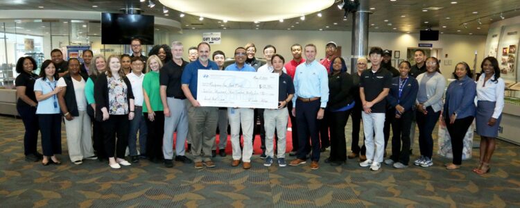 HMMA Team Donates $12,000 to Montgomery Food Bank